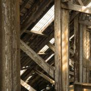 Wooden beams under the ceiling. Photo by Leo Fosdal on Unsplash